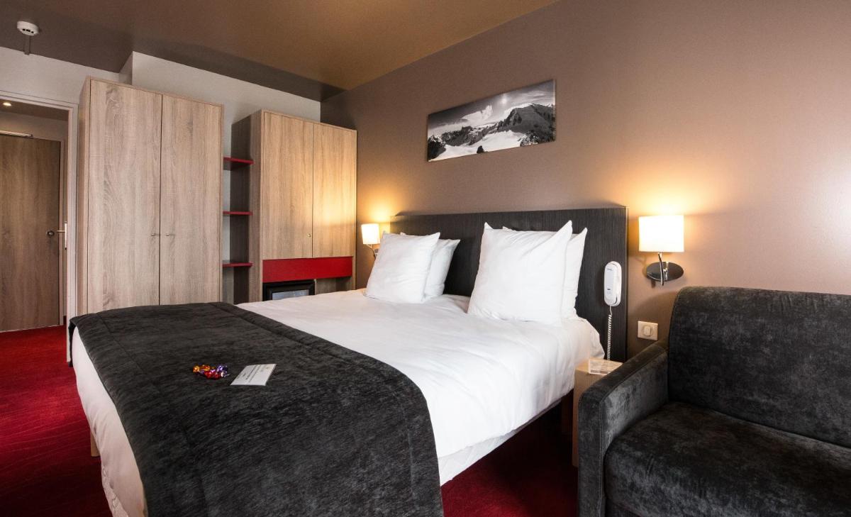 Un ou plusieurs lits dans un hébergement de l'établissement SOWELL HOTELS Le Parc & Spa