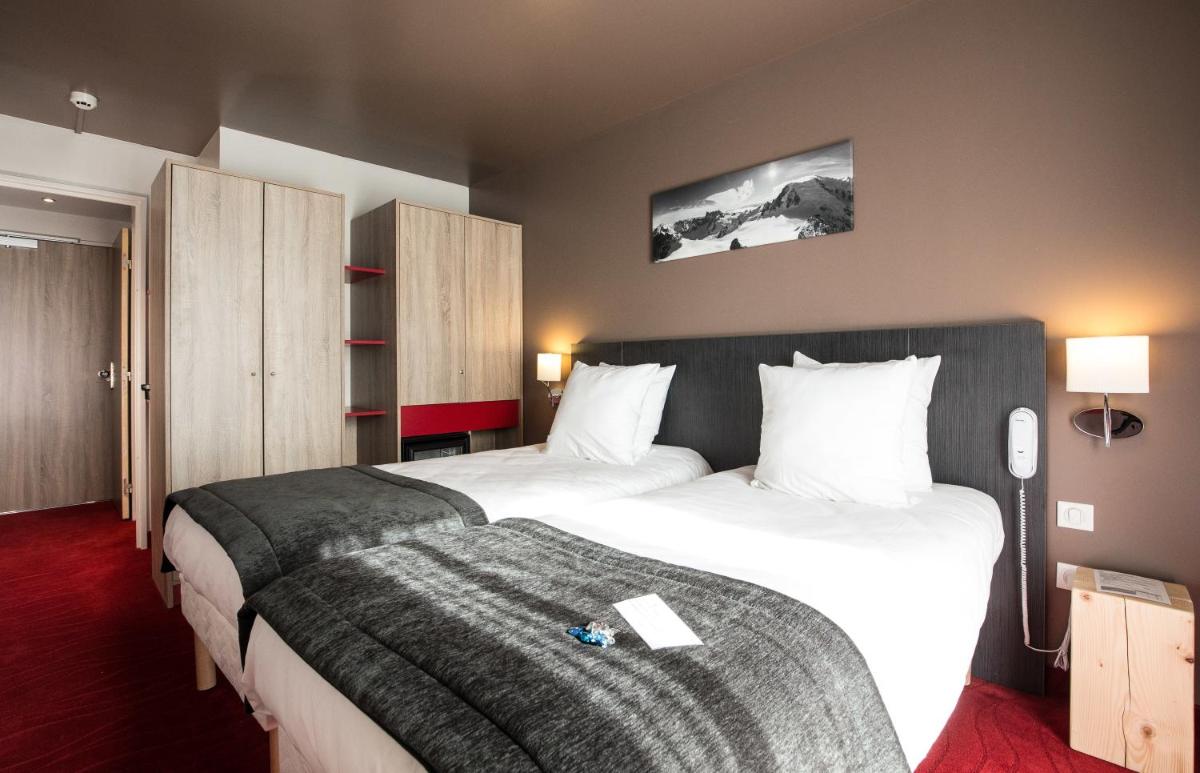 Un ou plusieurs lits dans un hébergement de l'établissement SOWELL HOTELS Le Parc & Spa