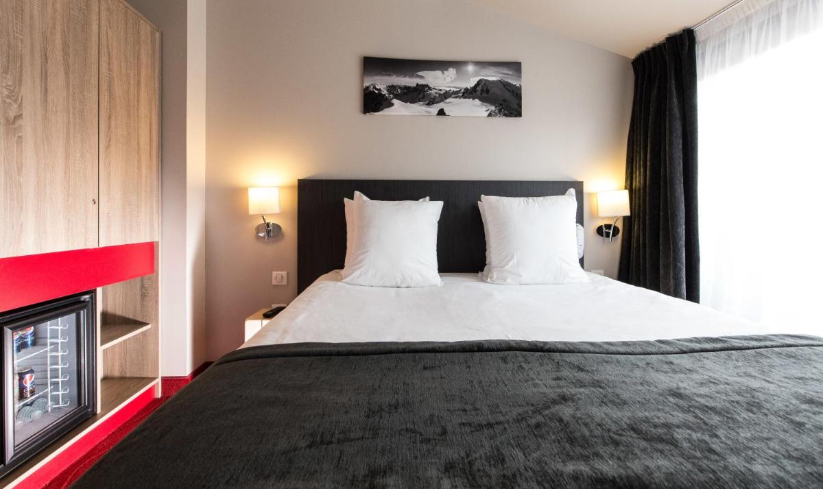 Un ou plusieurs lits dans un hébergement de l'établissement SOWELL HOTELS Le Parc & Spa