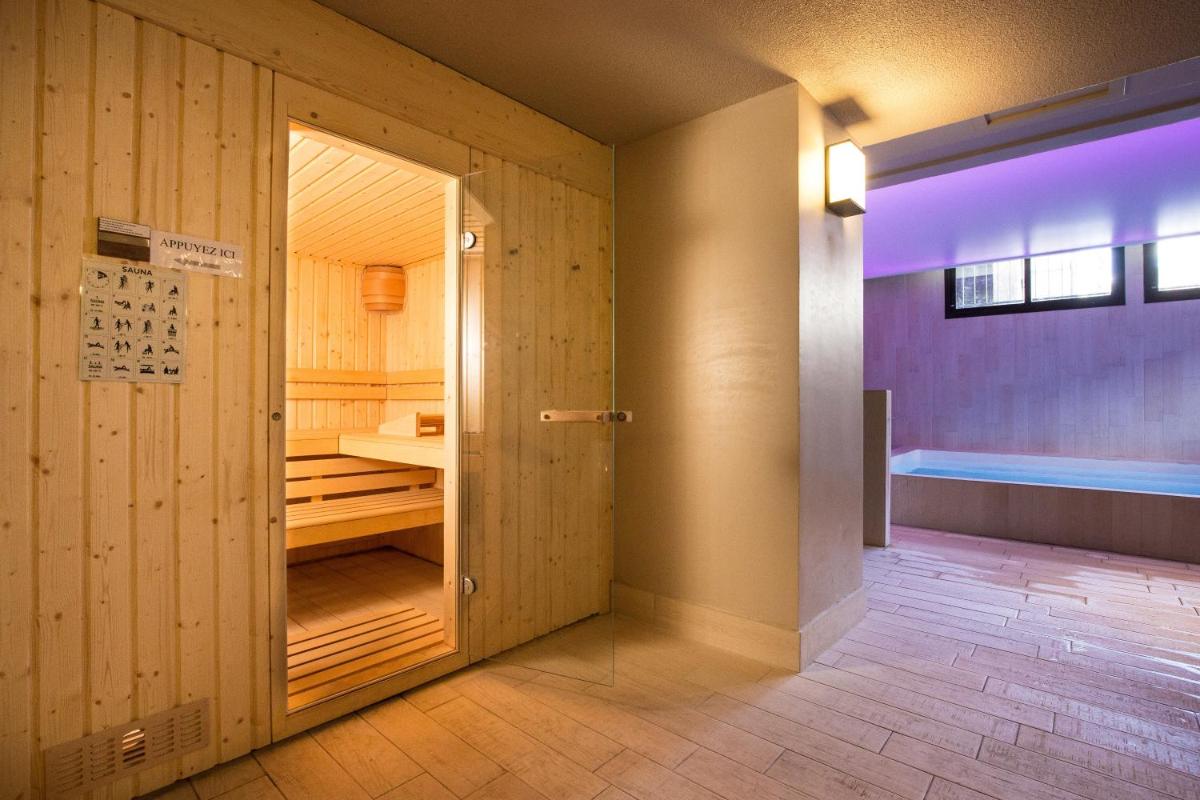 Un ou plusieurs lits dans un hébergement de l'établissement SOWELL HOTELS Le Parc & Spa
