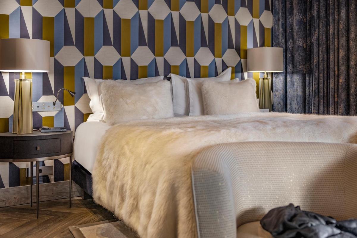 Un ou plusieurs lits dans un hébergement de l'établissement Armancette - The Leading Hotels of the World