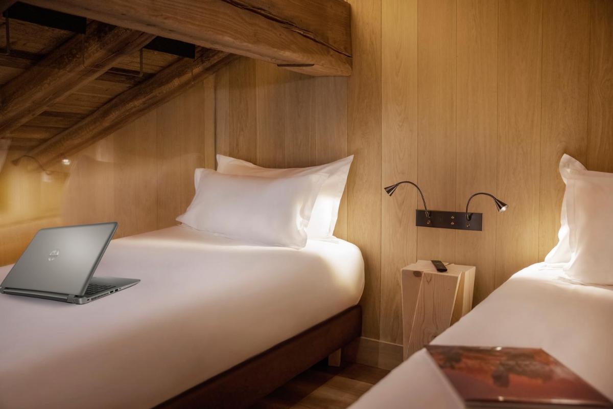 Un ou plusieurs lits dans un hébergement de l'établissement Armancette - The Leading Hotels of the World