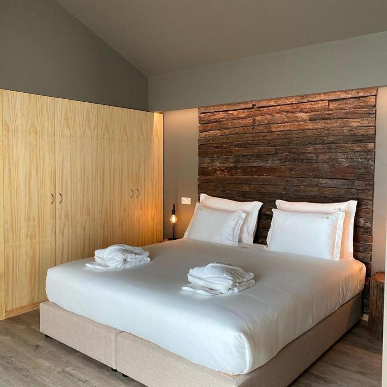 Uma cama ou camas num quarto em Quinta do Pedregal Hotel & Spa