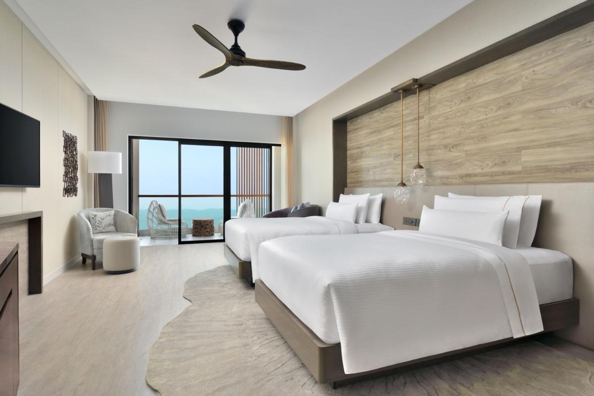 a bedroom with two beds and a ceiling fan at The Westin Resort & Spa Himalayas in Rishīkesh