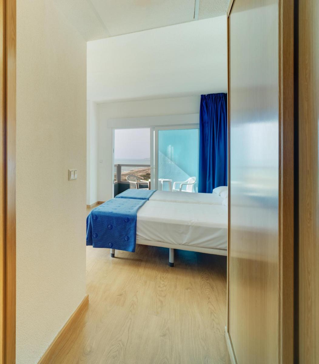 Cama o camas de una habitación en Hotel Playas de Guardamar