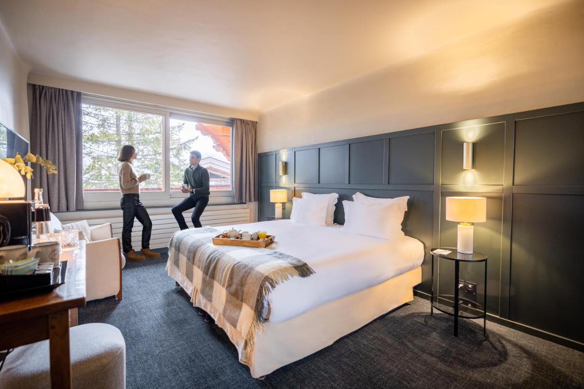 Un ou plusieurs lits dans un hébergement de l'établissement Grand Hôtel Courchevel 1850