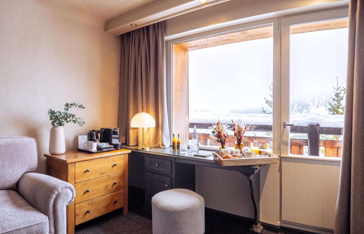 Coin salon dans l'établissement Grand Hôtel Courchevel 1850