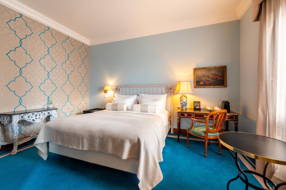 Uma cama ou camas num quarto em Pestana Palace Lisboa Hotel & National Monument - The Leading Hotels of the World