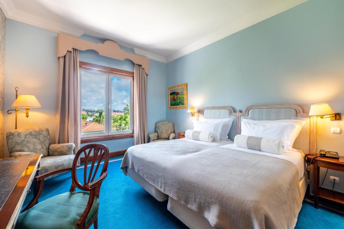 Uma cama ou camas num quarto em Pestana Palace Lisboa Hotel & National Monument - The Leading Hotels of the World
