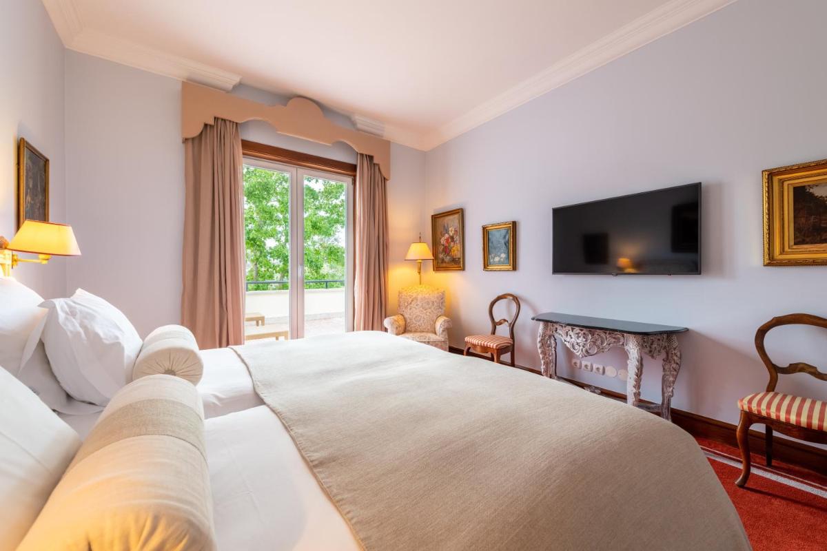 Uma cama ou camas num quarto em Pestana Palace Lisboa Hotel & National Monument - The Leading Hotels of the World
