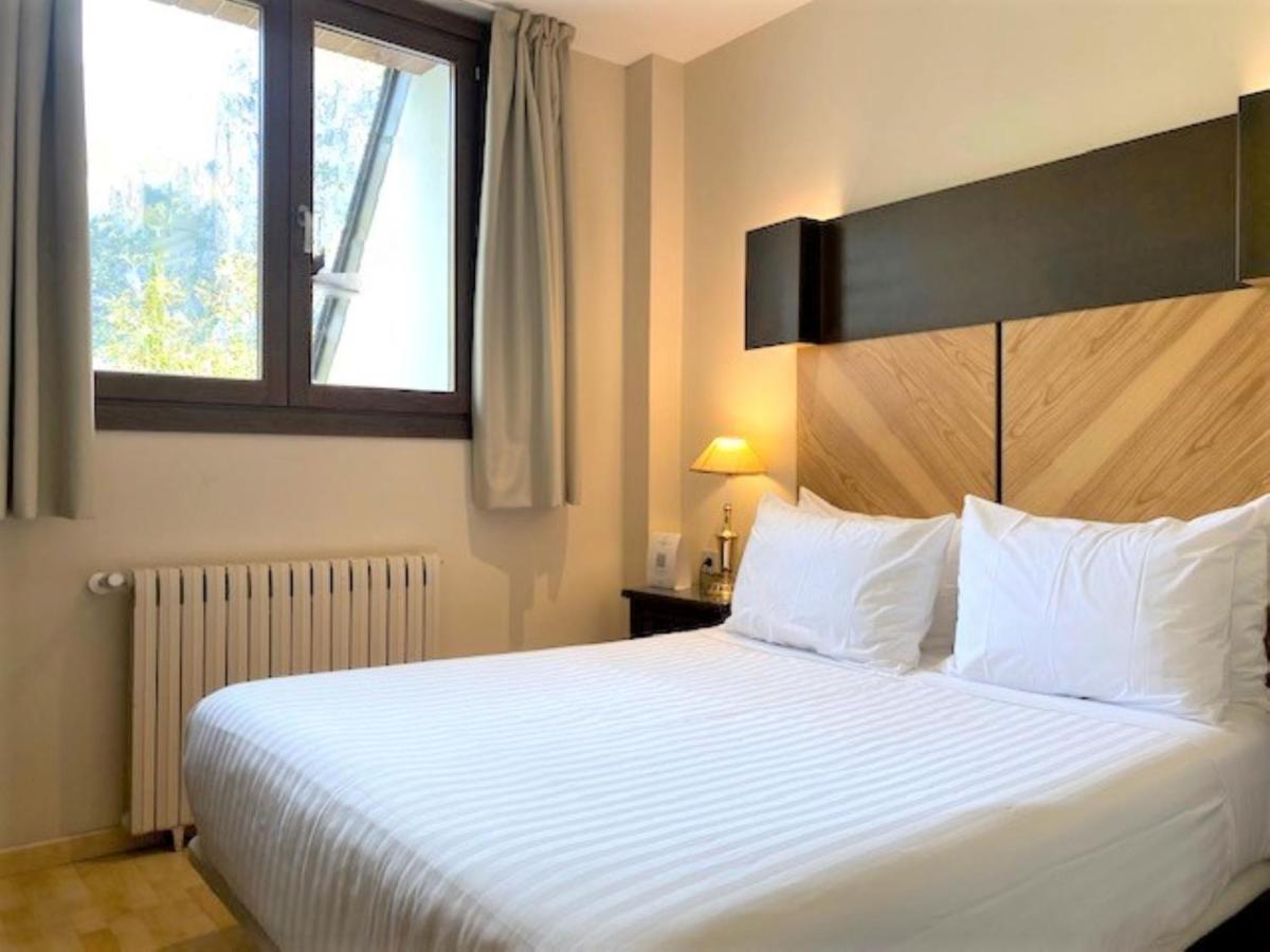 Cama o camas de una habitación en Silken Ordesa