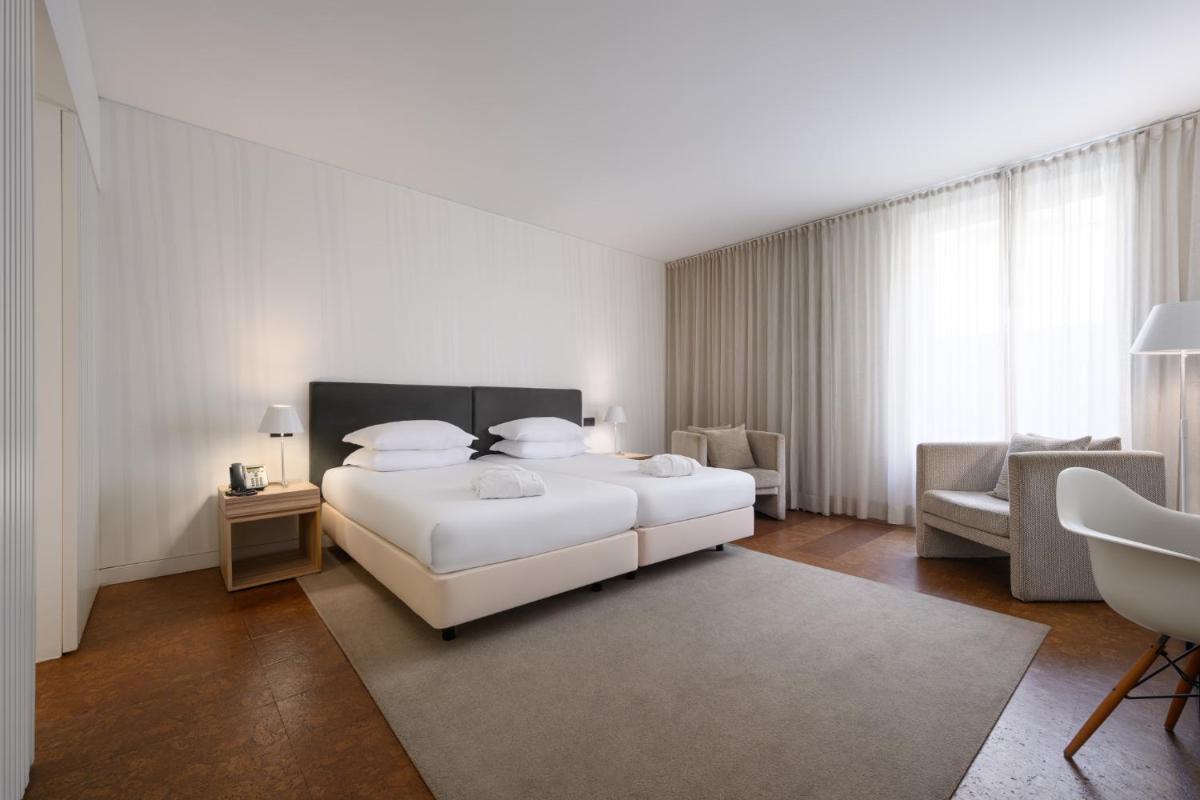 Uma cama ou camas num quarto em Inspira Liberdade Boutique Hotel
