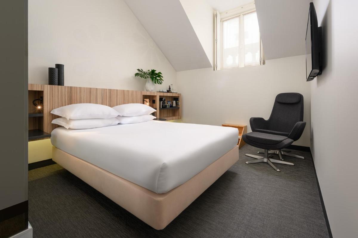 Uma cama ou camas num quarto em Inspira Liberdade Boutique Hotel