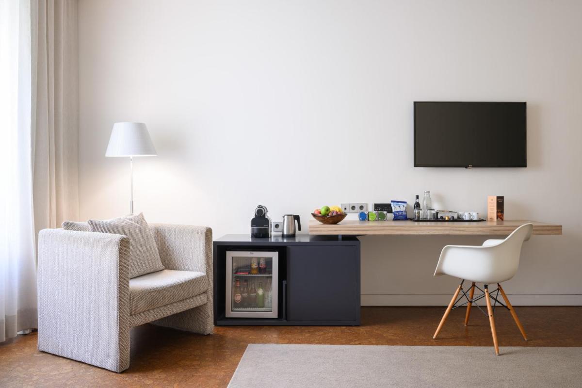 Uma televisão e/ou sistema de entretenimento em Inspira Liberdade Boutique Hotel