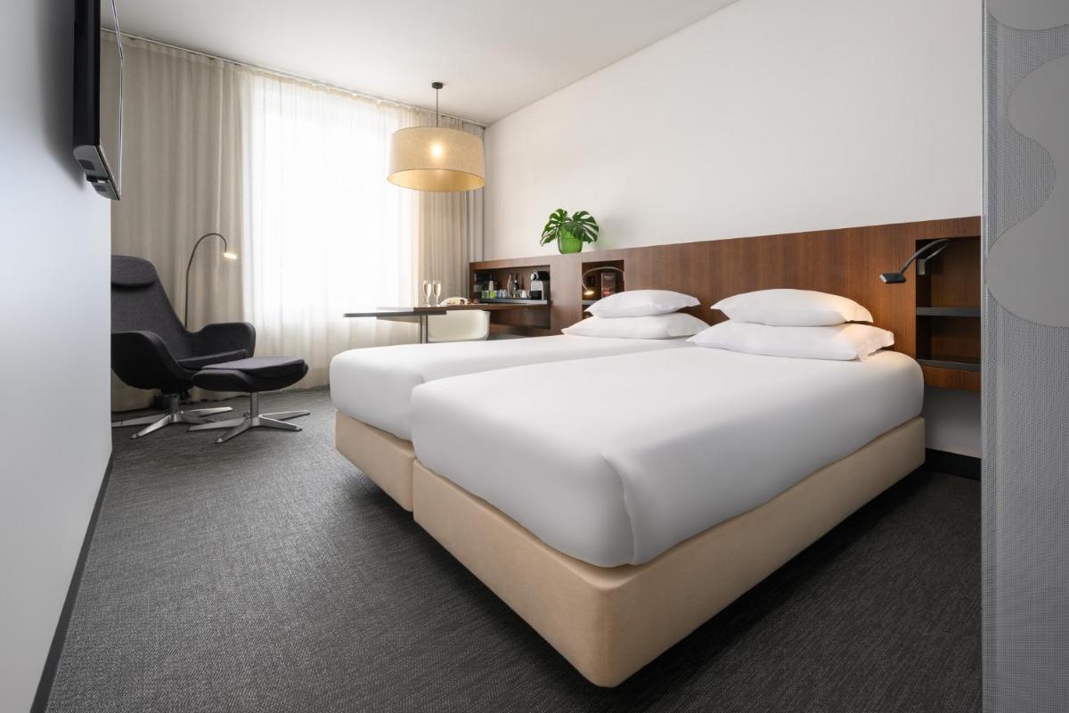 Uma cama ou camas num quarto em Inspira Liberdade Boutique Hotel