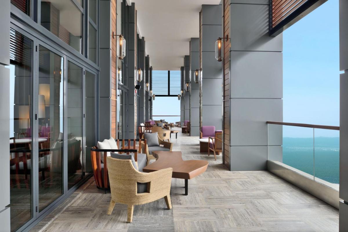 a lobby of a hotel with chairs and tables at The Westin Resort & Spa Himalayas in Rishīkesh