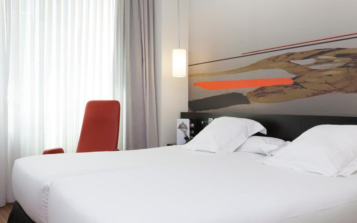 Cama o camas de una habitación en Axor Barajas