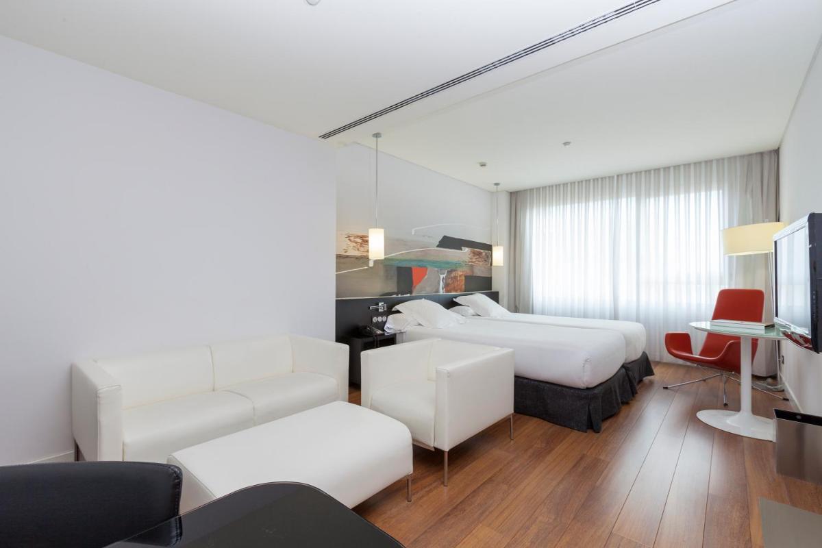 Cama o camas de una habitación en Axor Barajas