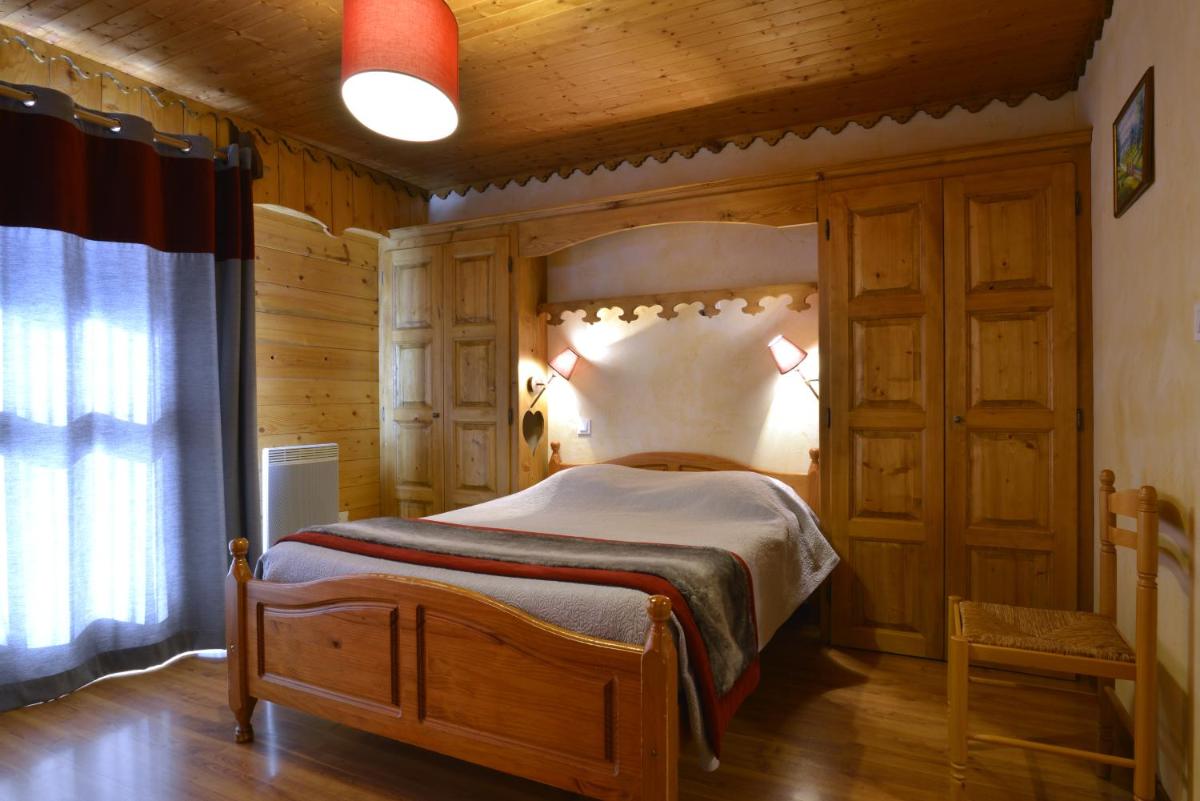 Un ou plusieurs lits dans un hébergement de l'établissement Hotel Le Ferraillon