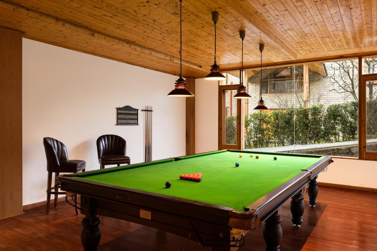 a billiard room with a pool table in a house at Baragarh Resort & Spa, Manali- IHCL SeleQtions in Manāli