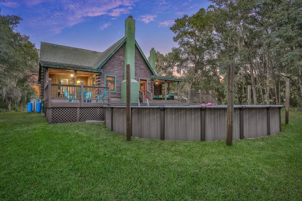 Cozy 4BR Cabin on 11 acres with pool, BBQ & patio! - Housity