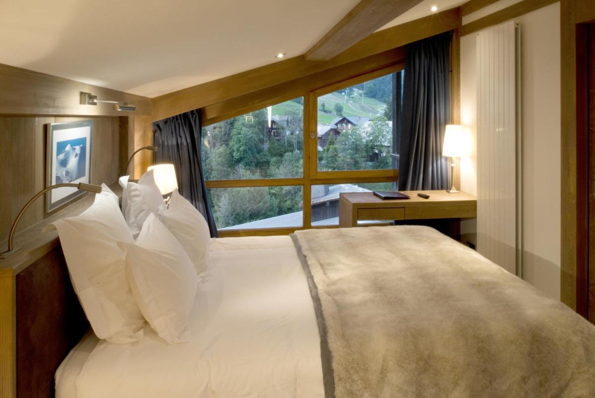 Un ou plusieurs lits dans un hébergement de l'établissement Hotel le Petit Dru