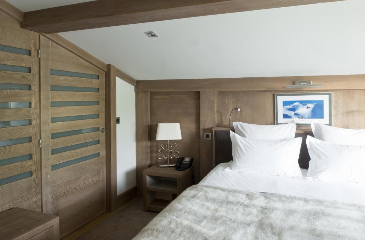 Un ou plusieurs lits dans un hébergement de l'établissement Hotel le Petit Dru