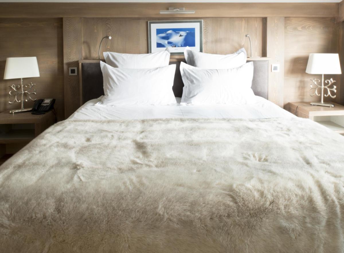 Un ou plusieurs lits dans un hébergement de l'établissement Hotel le Petit Dru