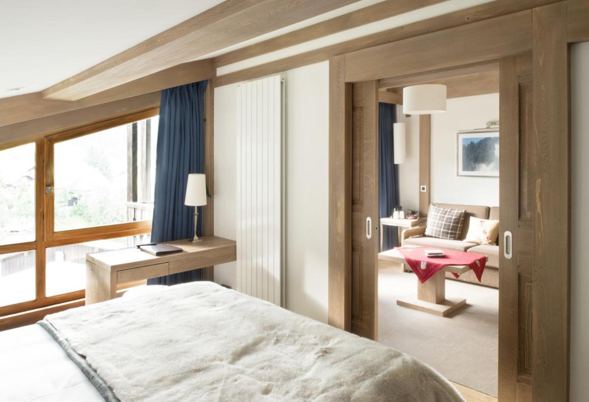 Un ou plusieurs lits dans un hébergement de l'établissement Hotel le Petit Dru