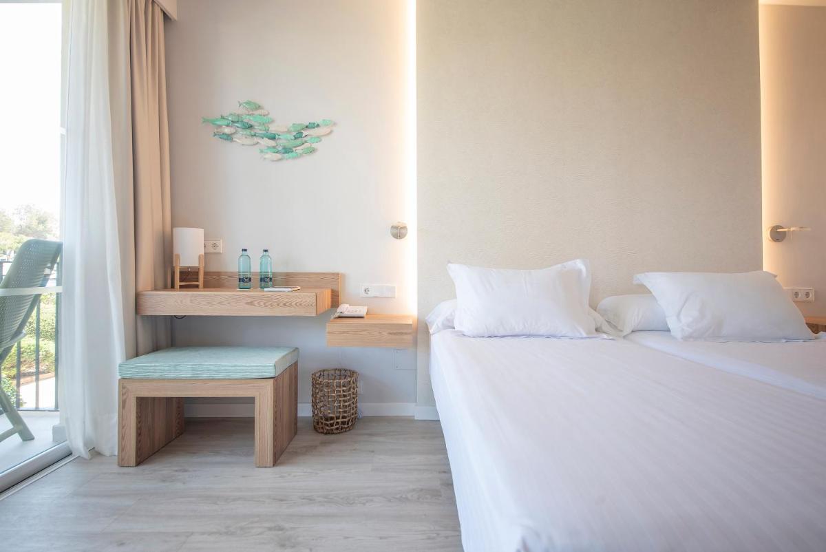 Cama o camas de una habitación en Blau Colònia Sant Jordi