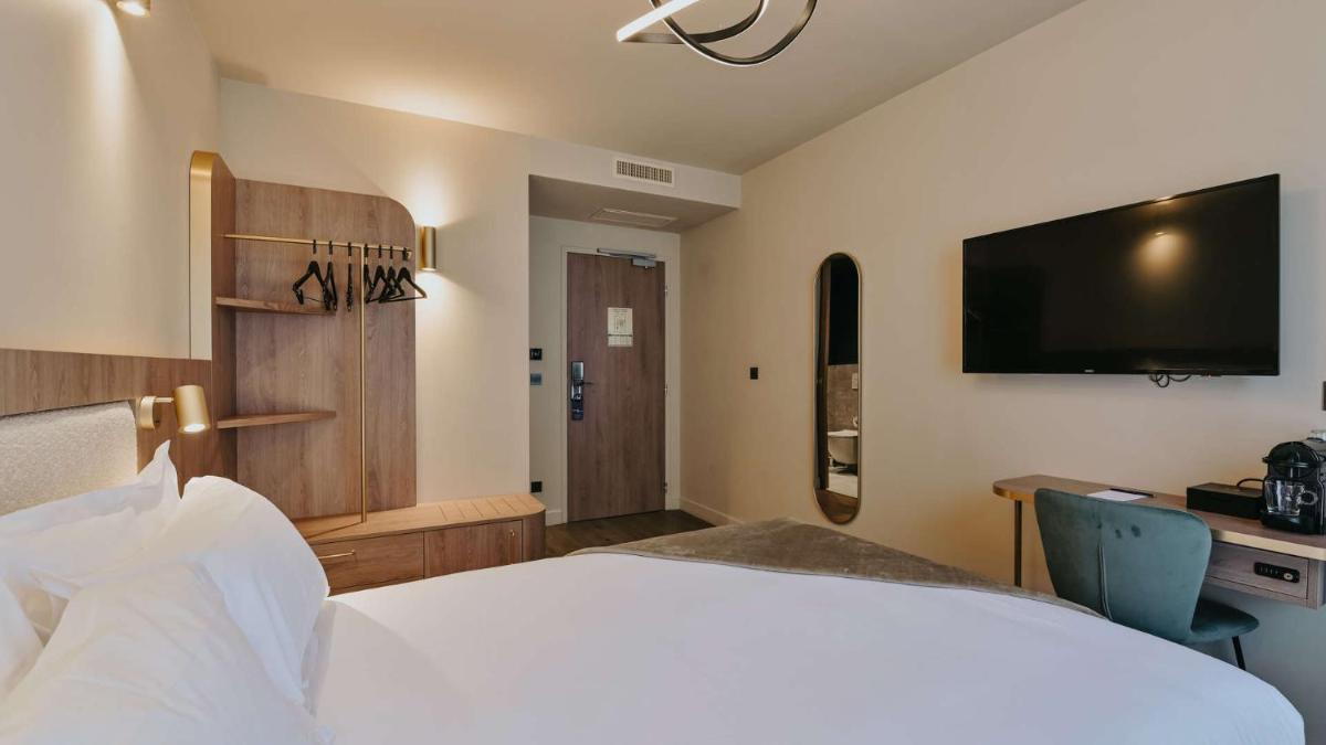 Un ou plusieurs lits dans un hébergement de l'établissement Keystone Hôtel & Spa
