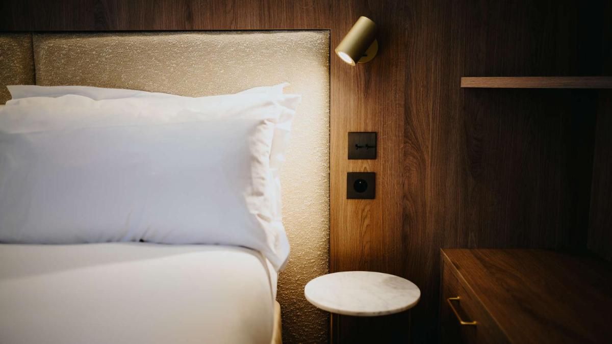 Un ou plusieurs lits dans un hébergement de l'établissement Keystone Hôtel & Spa