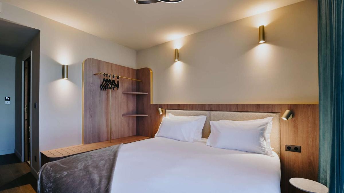 Un ou plusieurs lits dans un hébergement de l'établissement Keystone Hôtel & Spa
