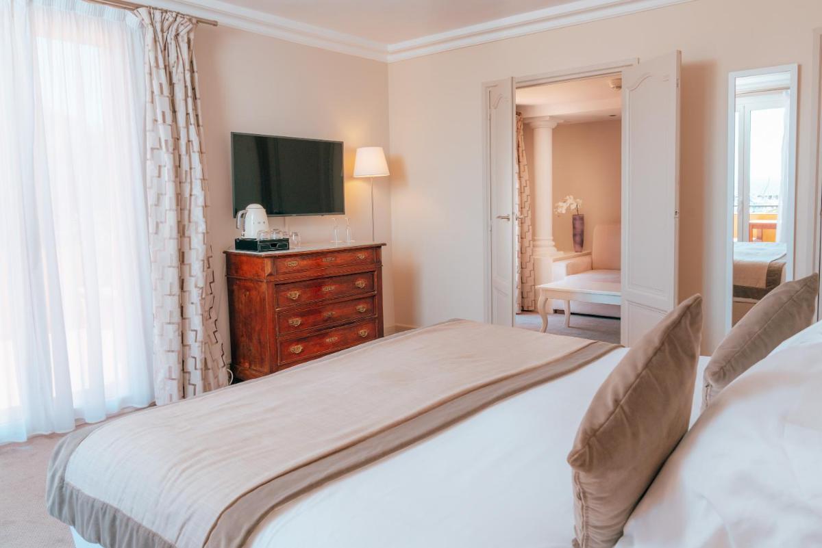 Un ou plusieurs lits dans un hébergement de l'établissement Ermitage de l'Oasis & Spa - Cannes Mandelieu