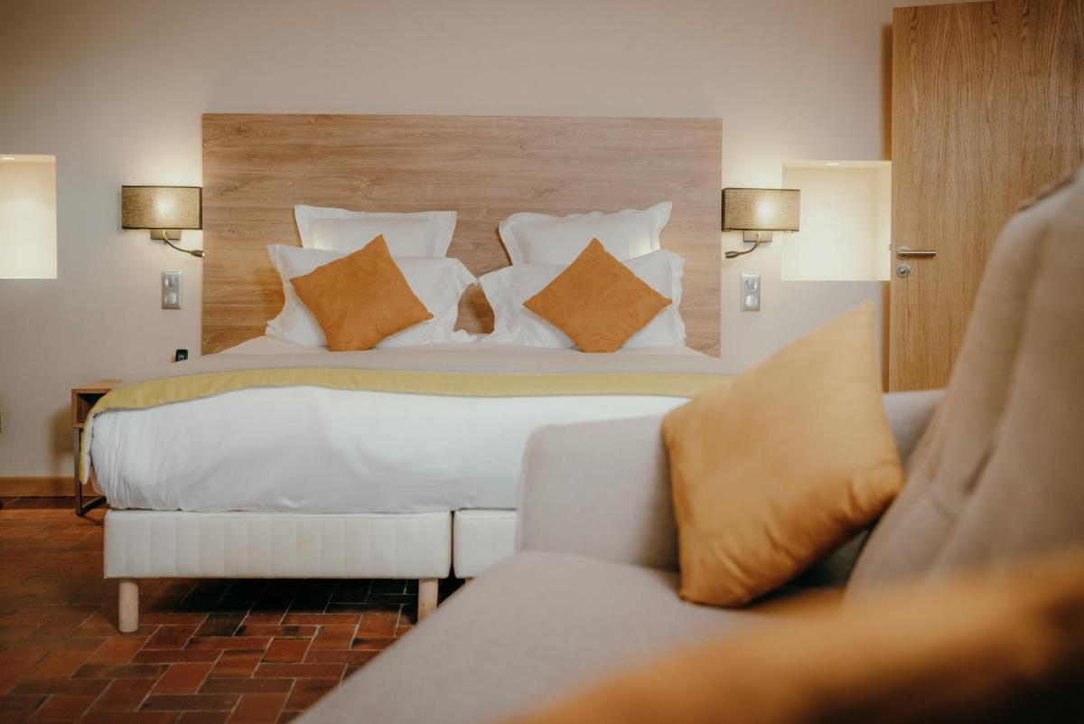 Un ou plusieurs lits dans un hébergement de l'établissement Ermitage de l'Oasis & Spa - Cannes Mandelieu