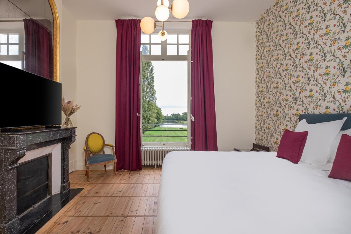 Un ou plusieurs lits dans un hébergement de l'établissement La Borde en Sologne Château & Spa