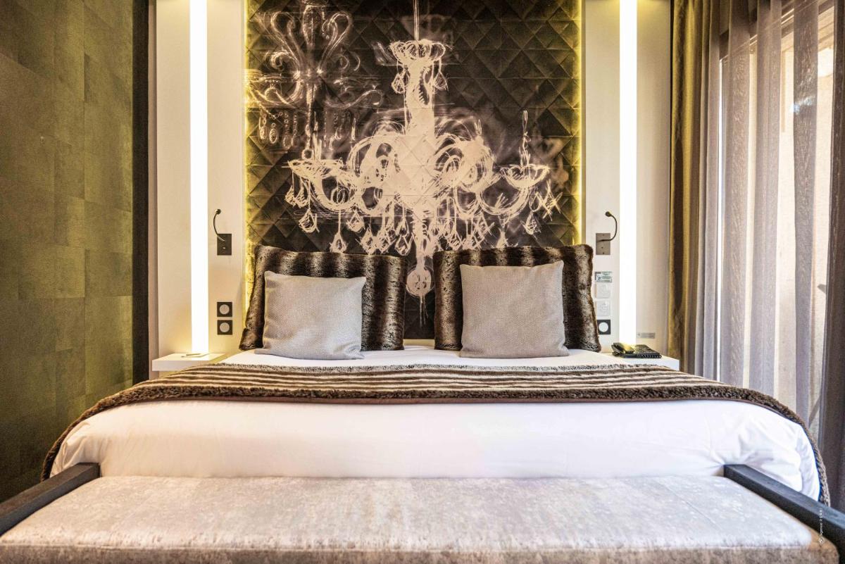 Un ou plusieurs lits dans un hébergement de l'établissement Hôtel Le Parc - La Table de Franck Putelat