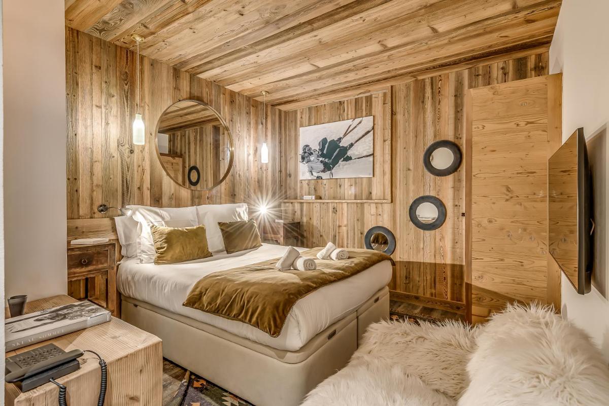 Un ou plusieurs lits dans un hébergement de l'établissement Hotel & Spa Le Val d'Isère