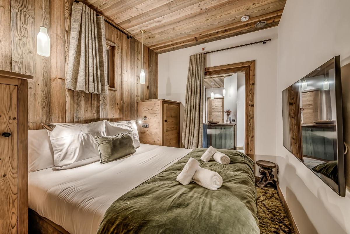 Un ou plusieurs lits dans un hébergement de l'établissement Hotel & Spa Le Val d'Isère