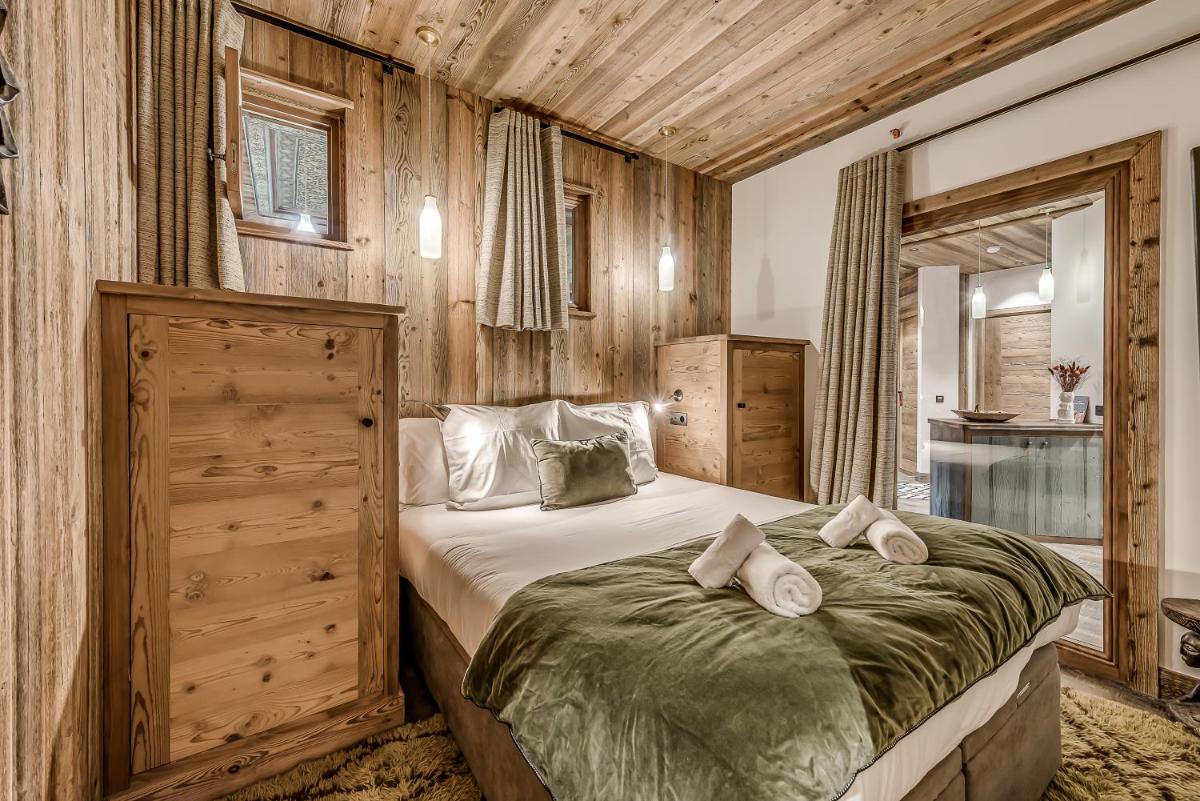 Un ou plusieurs lits dans un hébergement de l'établissement Hotel & Spa Le Val d'Isère
