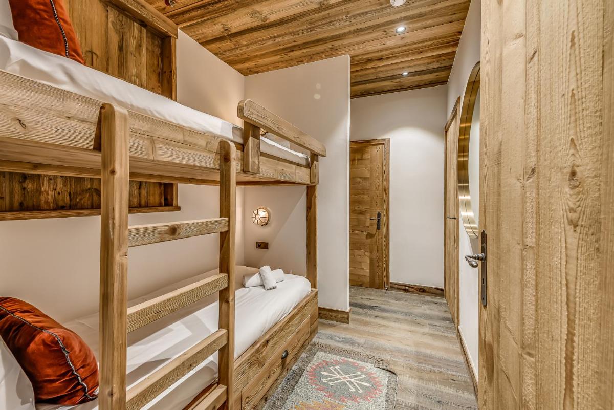 Un ou plusieurs lits dans un hébergement de l'établissement Hotel & Spa Le Val d'Isère