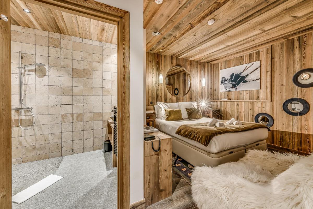 Un ou plusieurs lits dans un hébergement de l'établissement Hotel & Spa Le Val d'Isère