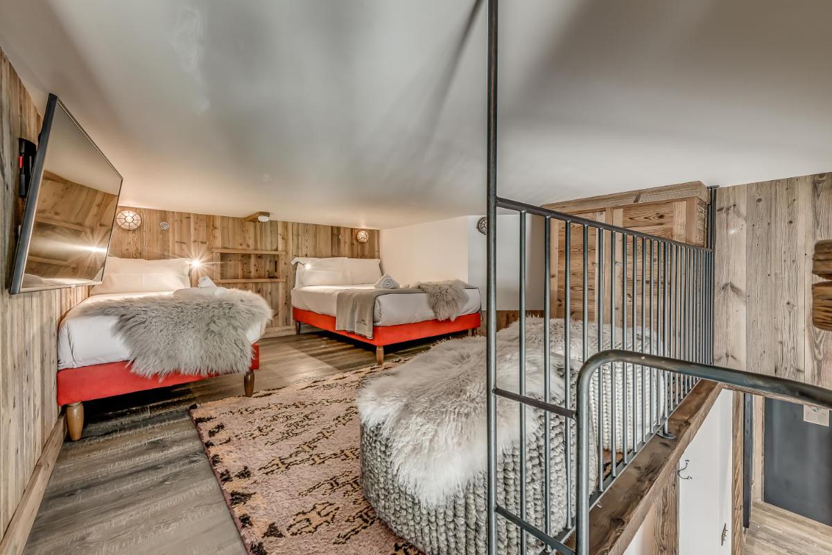 Un ou plusieurs lits dans un hébergement de l'établissement Hotel & Spa Le Val d'Isère