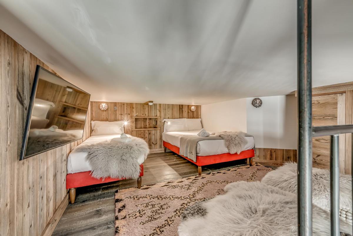 Un ou plusieurs lits dans un hébergement de l'établissement Hotel & Spa Le Val d'Isère