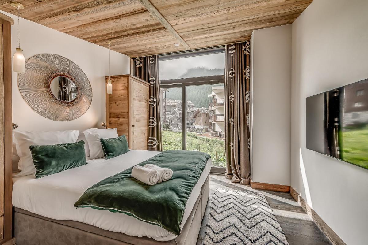 Un ou plusieurs lits dans un hébergement de l'établissement Hotel & Spa Le Val d'Isère