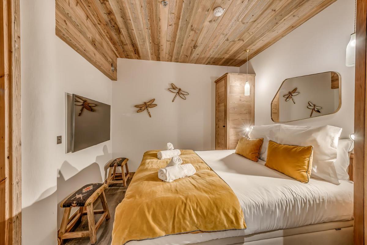 Un ou plusieurs lits dans un hébergement de l'établissement Hotel & Spa Le Val d'Isère