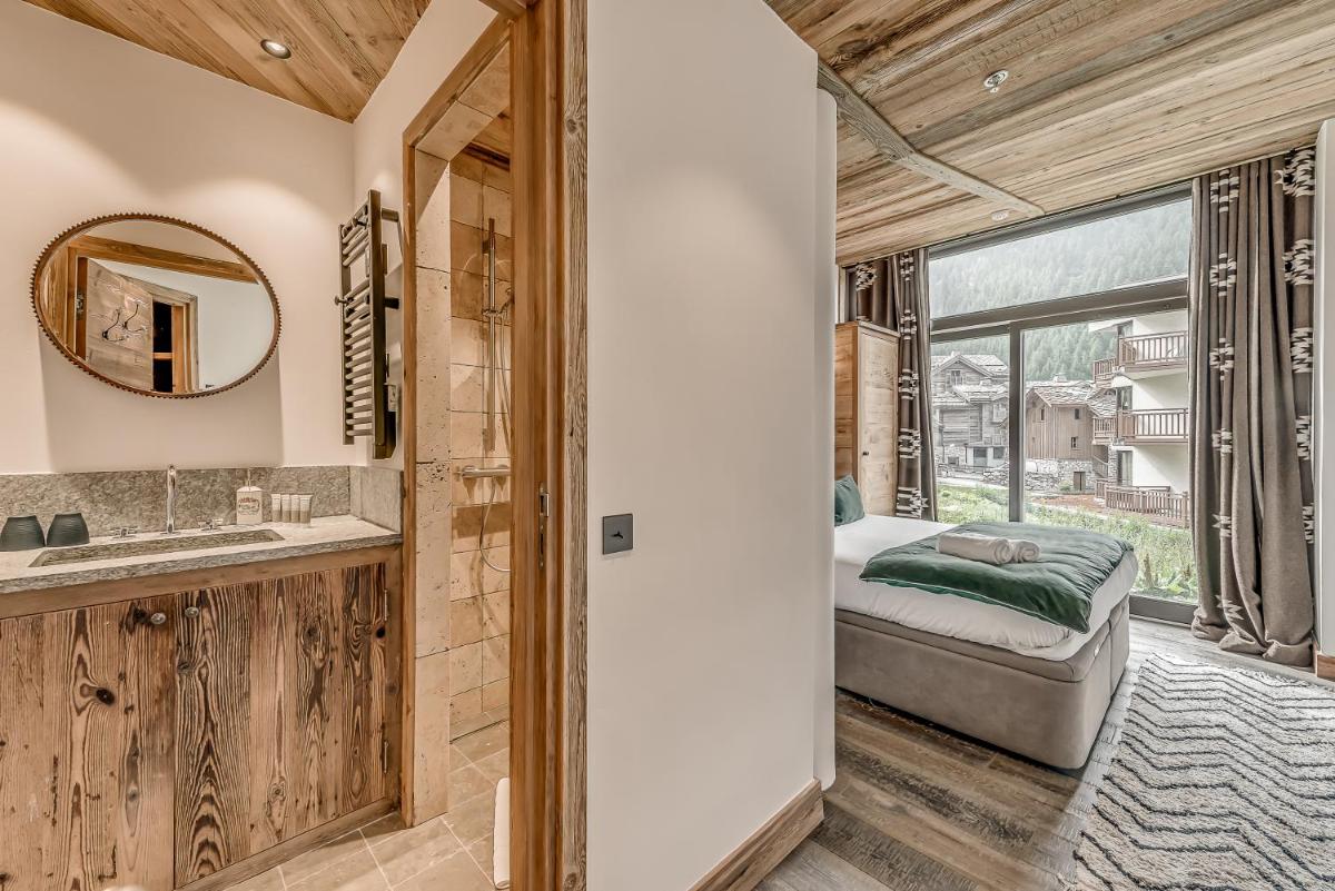 Un ou plusieurs lits dans un hébergement de l'établissement Hotel & Spa Le Val d'Isère