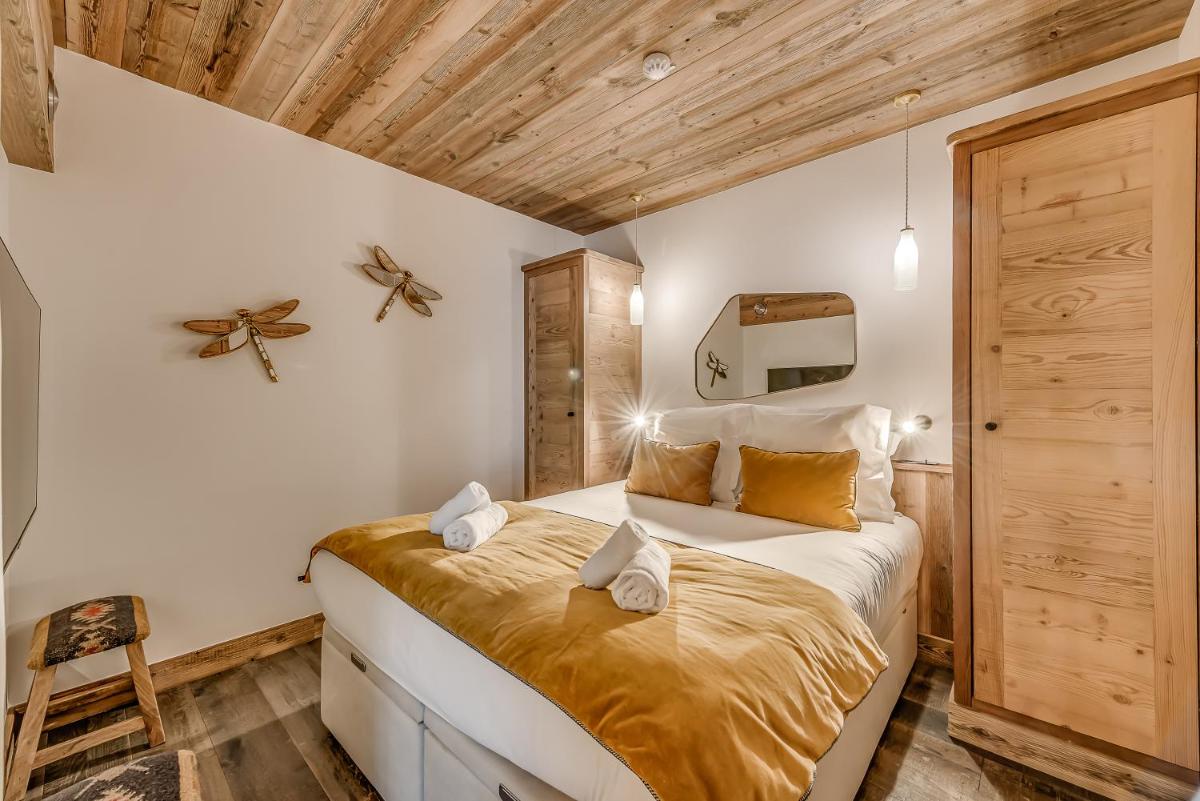 Un ou plusieurs lits dans un hébergement de l'établissement Hotel & Spa Le Val d'Isère