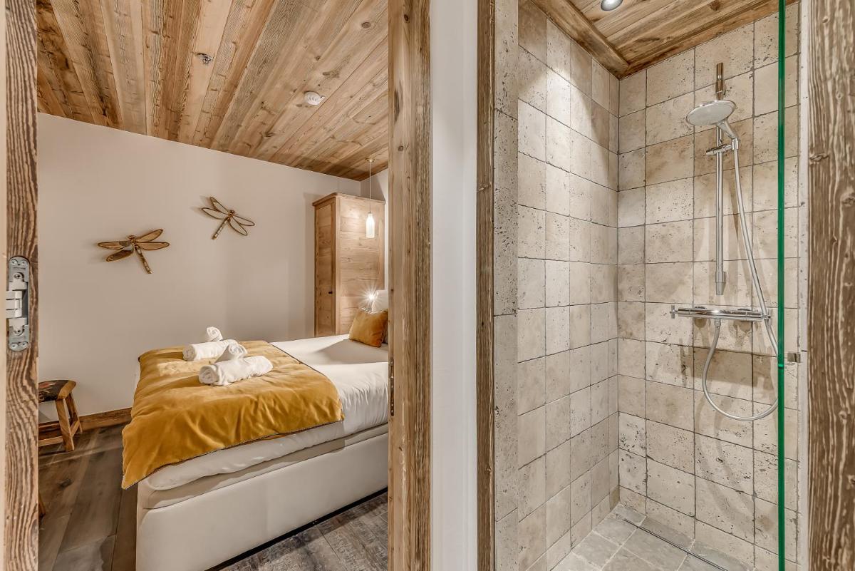 Un ou plusieurs lits dans un hébergement de l'établissement Hotel & Spa Le Val d'Isère