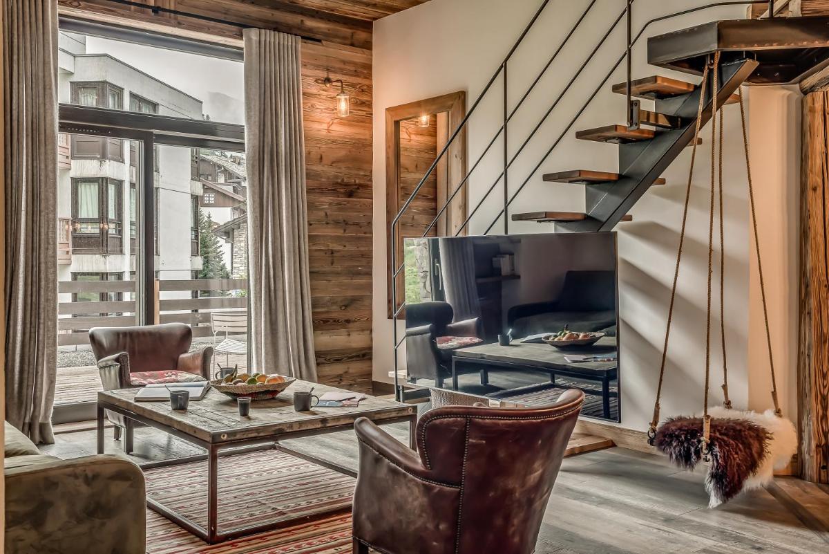 Télévision ou salle de divertissement dans l'établissement Hotel & Spa Le Val d'Isère
